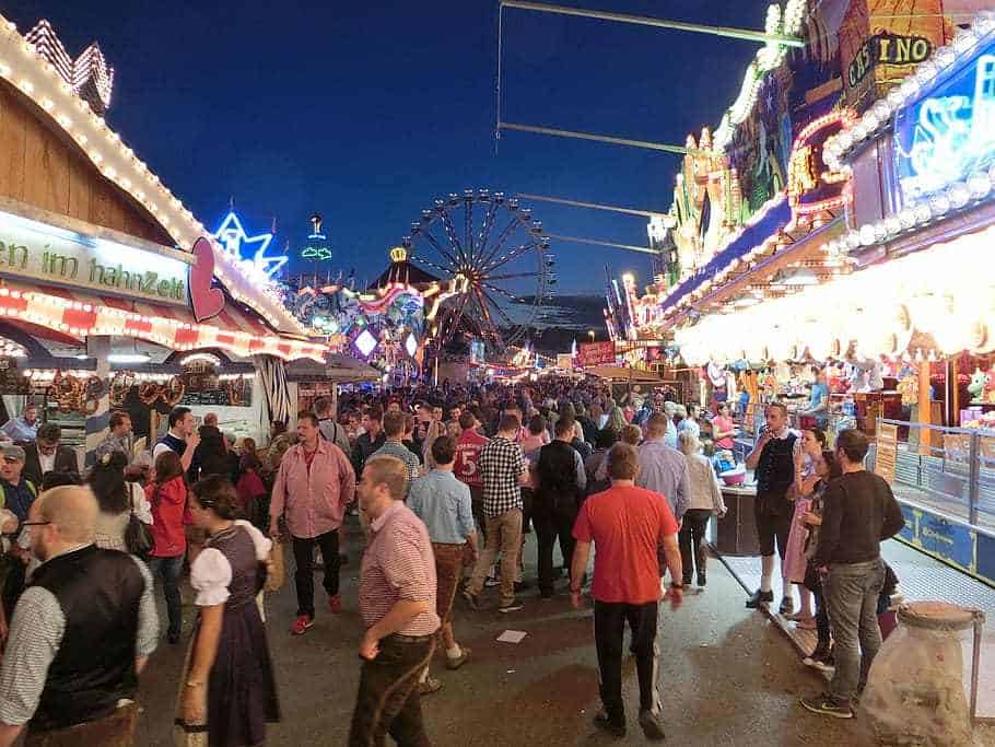 Fairground Malaga, Spain. The crowd of people on the fairground enjoying Feria de Malaga during the night time.