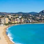 Beautiful view of the coastline of Malaga city, Andalusia, Spain with some residential buildings close to the beach during sunny day.