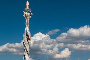 Silver Tall Helicoidal Santa Rosa Tower (or Machine) with Angels and Roses and Blue Sky in background: Architectural Design Structure