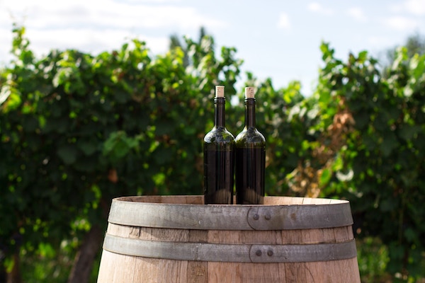 wine bottles on a barrel