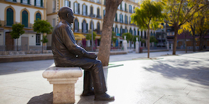 Malaga (Spain). Pablo Picasso Bronze Statue in Plaza de la Merced, Malaga city during sunny day.