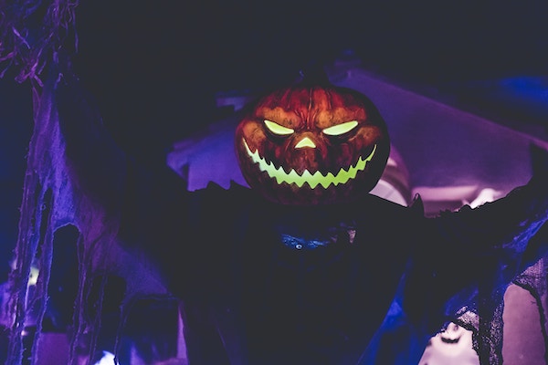 Man wearing pumpkin on Halloween in Malaga Party
