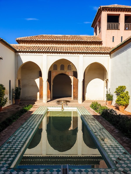 Alcazaba's Outer Citadel with a pool and arches