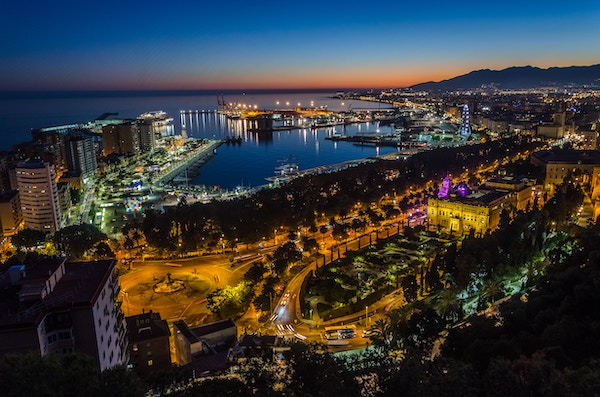 View of the Malaga Port and the Malaga Park from the sky at night