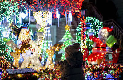 Christmas lights and ornaments are viewed outside of a home in Dyker Heights neighborhood of Brooklyn borough of New York, United States on December 6, 2022.