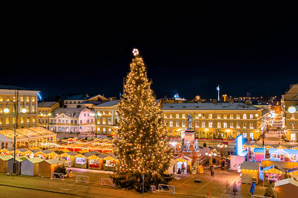 This pic shows The helsinki chrstmas market and illuminated Senat Square with the Helsinki cathedral in winter time. The square is decorated with Christmas lights and market. The pic is taken in december 2019.