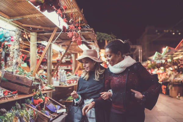 Mixed race girls shopping for Christmas in Barcelona