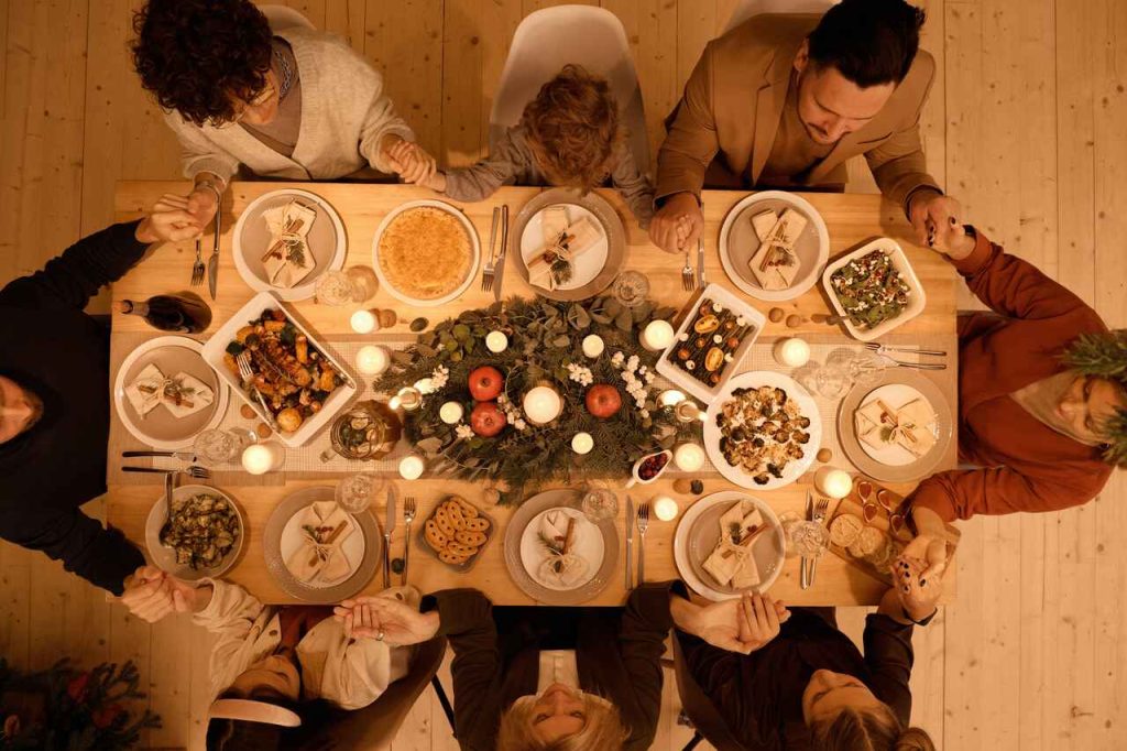 Christmas dinner with loved ones - table and dishes seen from above