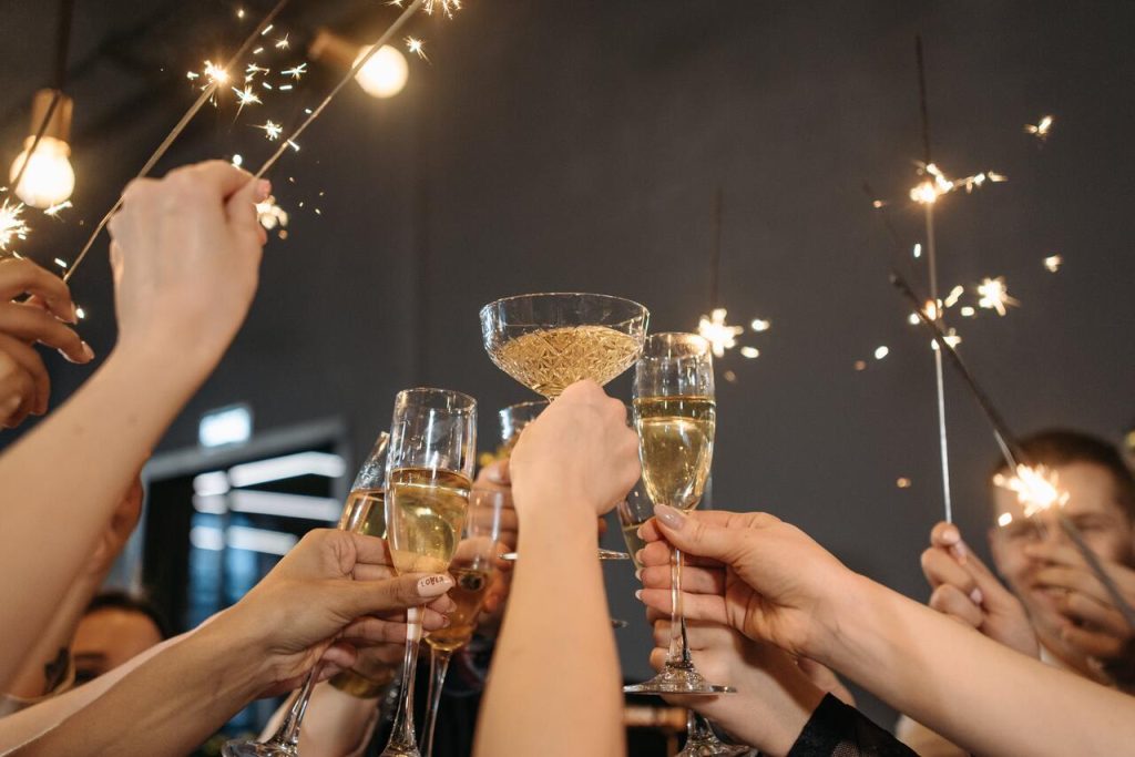 Celebrating the New Year with friends with alcohol and fireworks