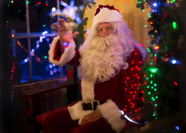 Santa Claus waving at kids