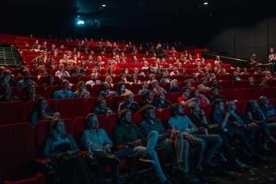 People watching a movie at a film festival.