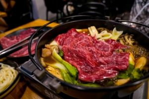 A hotpot containing Japanese meat and vegetables.
