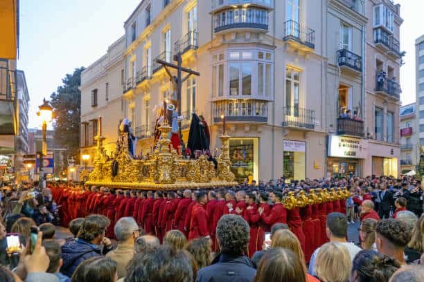Throne of Jesus in the procession of the Sangre brotherhood on holy wednesday evening, in the crowded town centre of Malaga