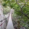 Granada Hiking route, the touristic way next to tress and big rocks.