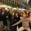 Pub Crawl Malaga. A group of people posing for a picture in the street.